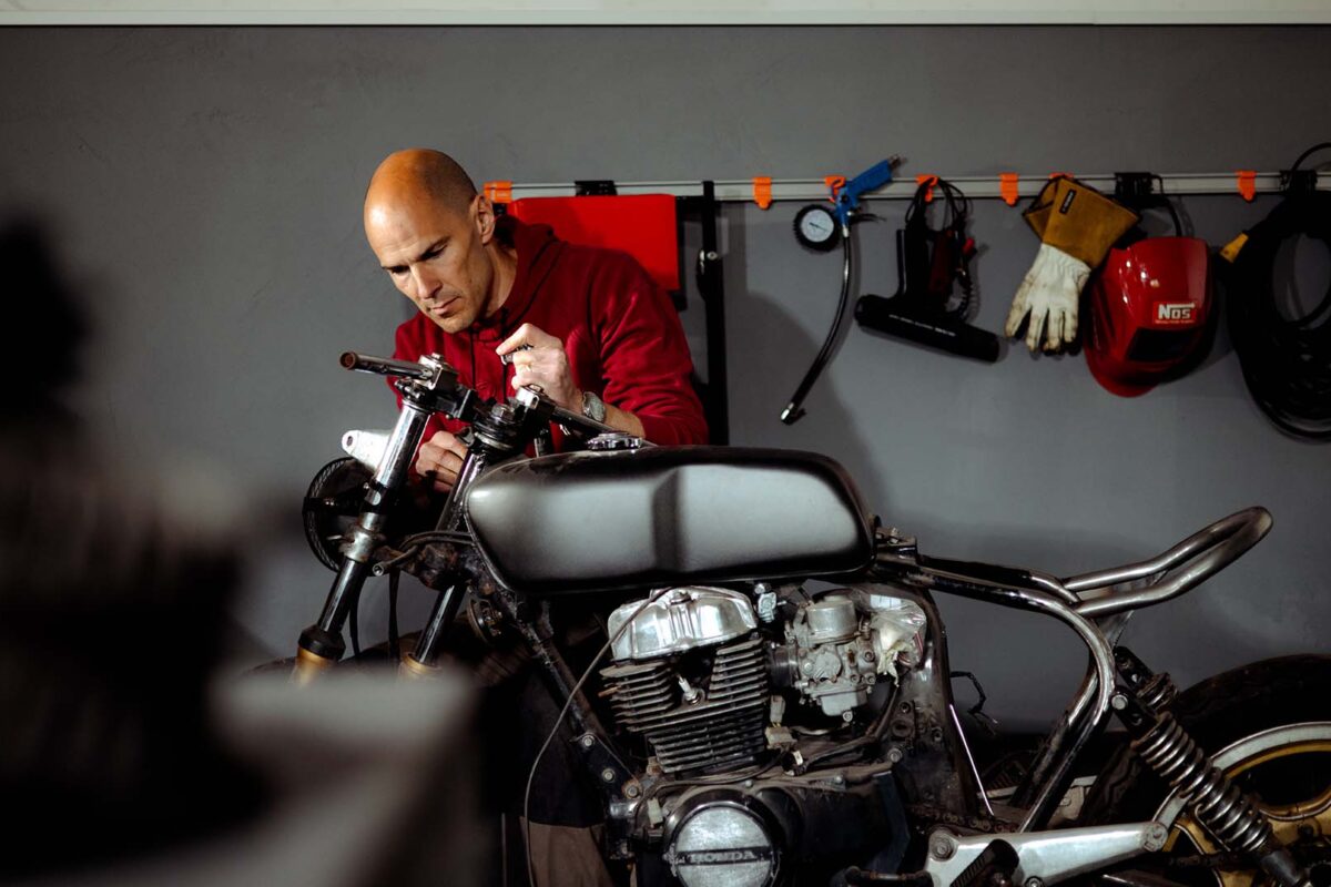 Toolflex garage - Man repairing motorcycle in garage